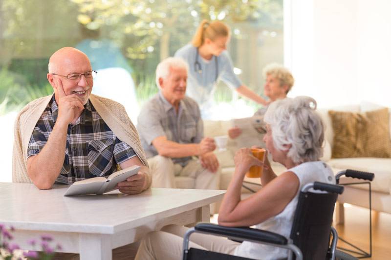 WLC Residents talking and reading at the Carrier Mills facility