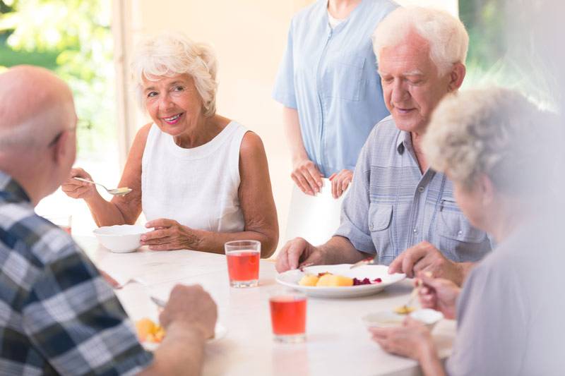 WLC Carrier Mills residents eating and talking